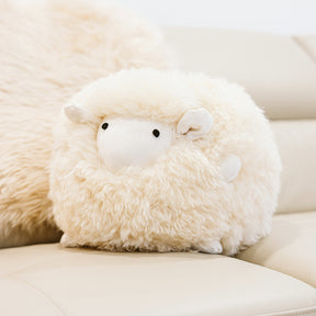 Close-up of Harold small sheepskin toy made from natural cream sheepskin