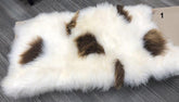 Icelandic sheepskin floor rug individual hide with natural brown and white spot pattern