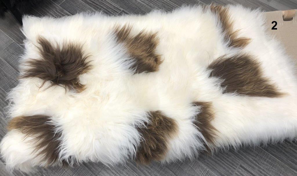 Icelandic sheepskin floor rug individual hide with natural brown and white spot pattern