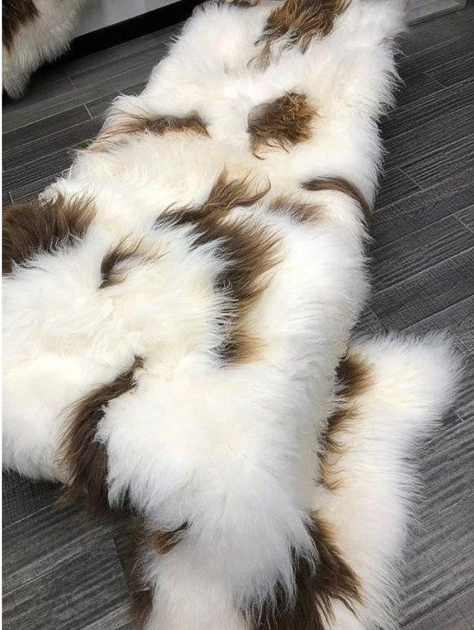 Icelandic sheepskin floor rug in natural brown and white spot pattern