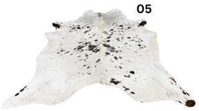 Light speckled longhorn cowhide rug number 05 with soft tonal variation and natural markings on a white background