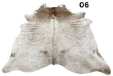Light speckled longhorn cowhide rug number 06 with soft tonal variation and natural markings on a white background