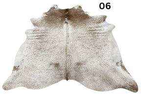 Light speckled longhorn cowhide rug number 06 with soft tonal variation and natural markings on a white background