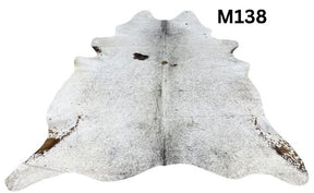 Light speckled longhorn cowhide rug number 138 with soft tonal variation and natural markings on a white background