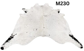 Light speckled longhorn cowhide rug number 230 with soft tonal variation and natural markings on a white background