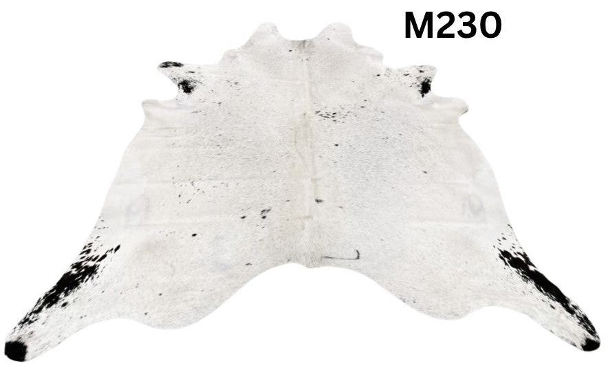 Light speckled longhorn cowhide rug number 230 with soft tonal variation and natural markings on a white background