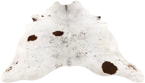 Light speckled longhorn cowhide rug example showing soft tonal variation and natural markings on a white background