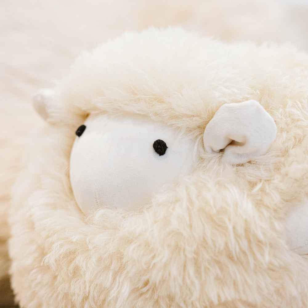 Close-up detail of Marty sheepskin toy made from natural cream sheepskin