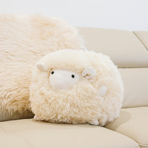 Marty sheepskin toy made from natural cream sheepskin styled on a sofa