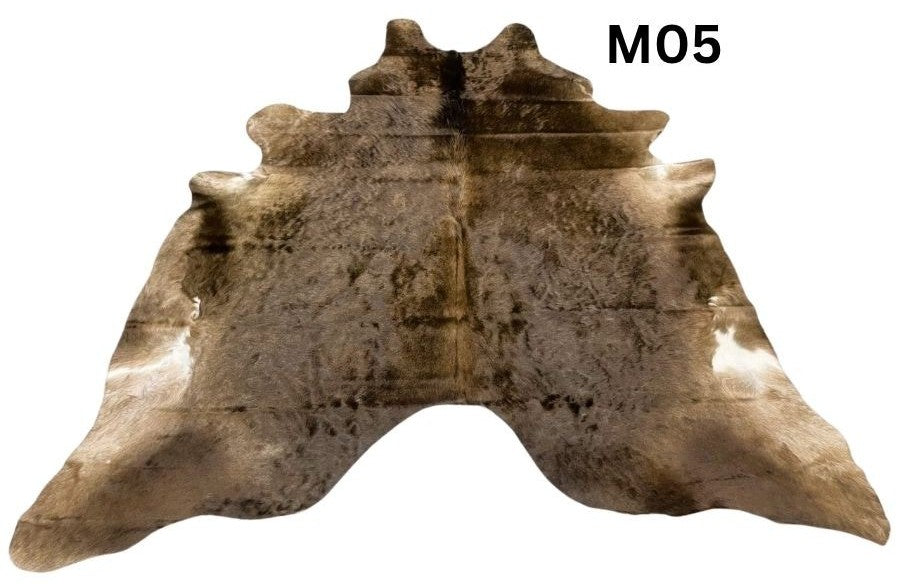 Mocha latte cowhide rug number 05 with natural tonal variation and markings on a white background