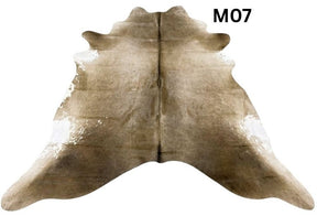Mocha latte cowhide rug number 07 with natural tonal variation and markings on a white background