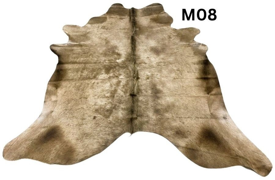 Mocha latte cowhide rug number 08 with natural tonal variation and markings on a white background