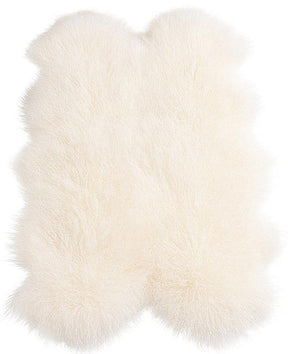 Natural white Mongolian sheepskin area rug made from four hides on a white background