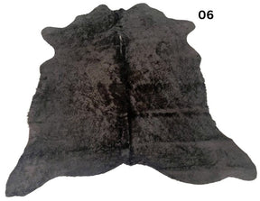 Natural black cowhide rug number 06 with subtle tonal variation and natural markings on a white background