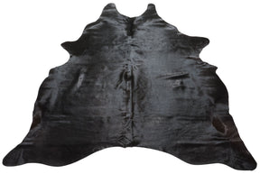 Natural black cowhide rug example showing rich dark tones and subtle variation on a white background