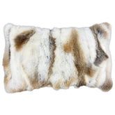 Natural brown and white rabbit fur lumbar cushion on white background