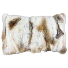 Natural brown and white rabbit fur lumbar cushion on white background