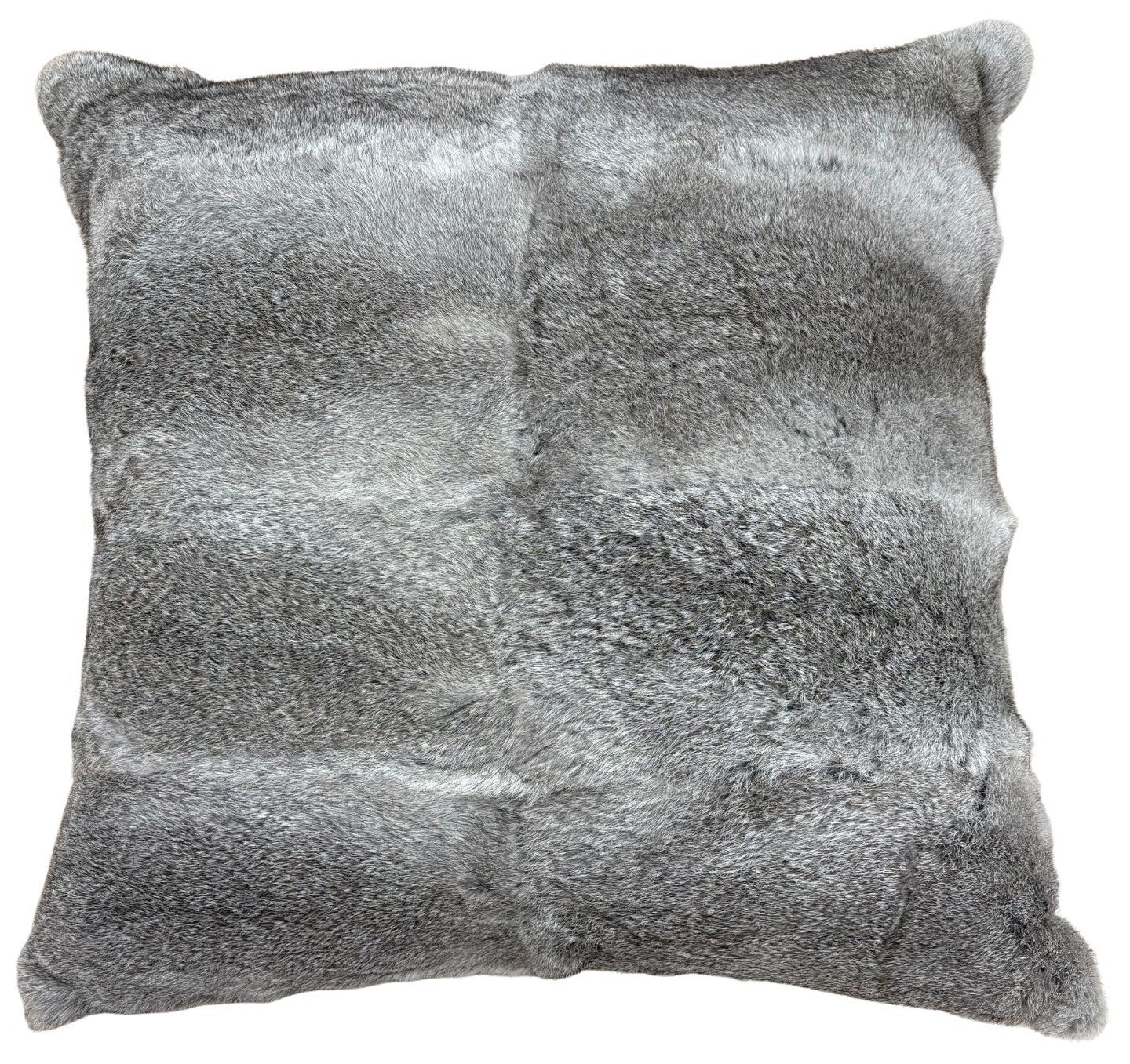 A grey rabbit fur pillow in a 60cm size styled on a chair, showing its soft texture and natural fur detail.