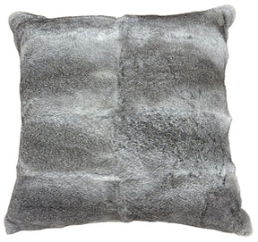 A grey rabbit fur pillow in a 60cm size styled on a chair, showing its soft texture and natural fur detail.