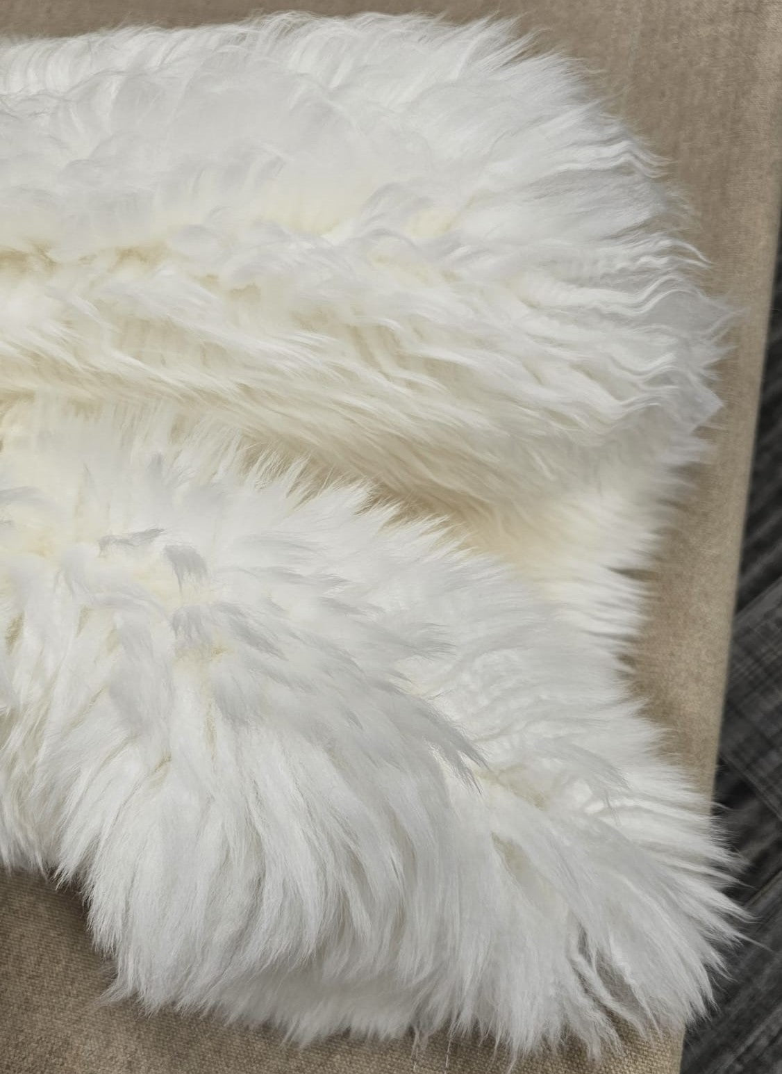 Close up of natural white New Zealand sheepskin wool texture