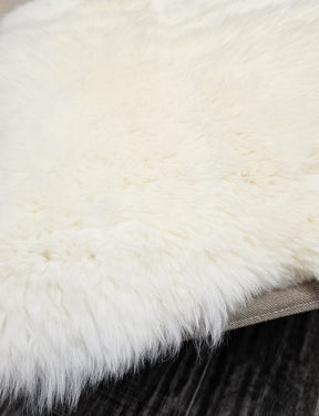 Edge detail of natural white New Zealand sheepskin rug