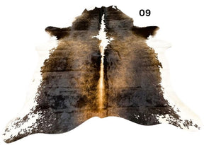 Small reddish brown cowhide rug number 09 with lighter central tones and natural markings on a white background