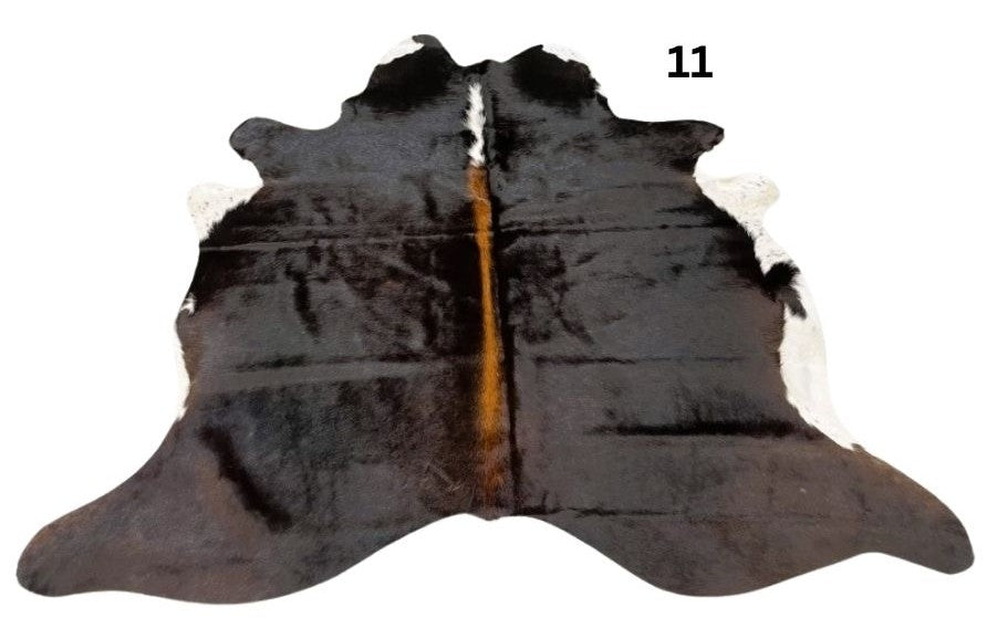 Small reddish brown cowhide rug number 11 with lighter central tones and natural markings on a white background