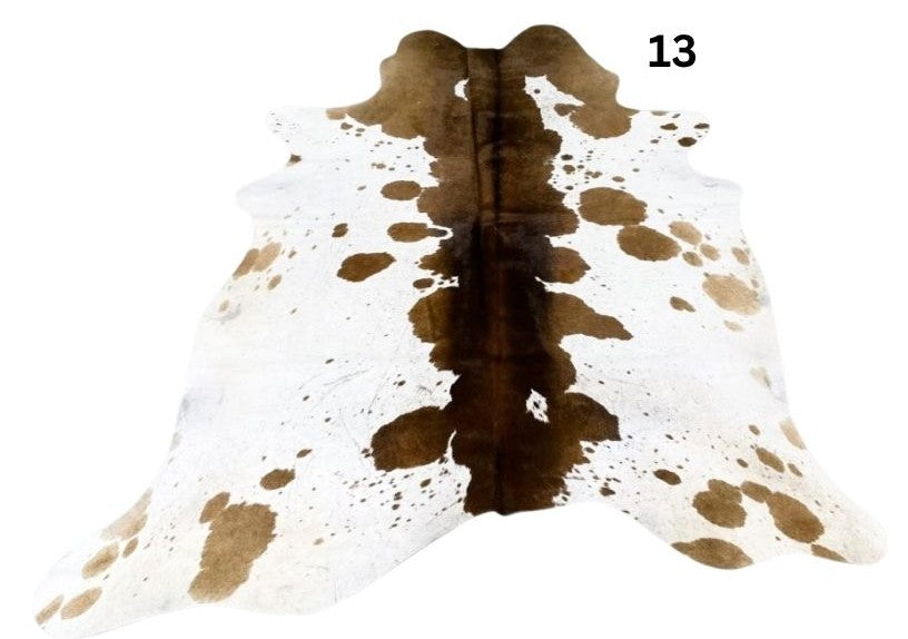 Reddish brown cowhide rug small size hide 13 genuine hide with lighter base and scattered brown markings displayed on white background