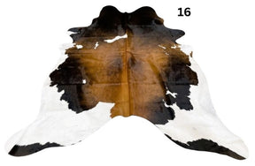 Reddish brown cowhide rug small size hide 16 genuine hide with lighter base and scattered brown markings displayed on white background