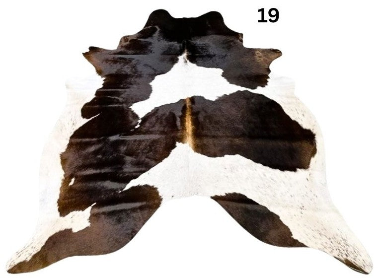 Reddish brown cowhide rug small size hide 19 genuine hide with lighter base and scattered brown markings displayed on white background
