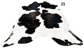 Reddish brown cowhide rug small size hide 21 genuine hide with lighter base and scattered brown markings displayed on white background