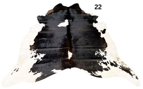 Reddish brown cowhide rug small size hide 22 genuine hide with lighter base and scattered brown markings displayed on white background