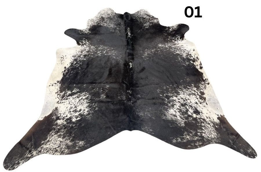 Salt and pepper cowhide rug number 01 with natural markings on a white background