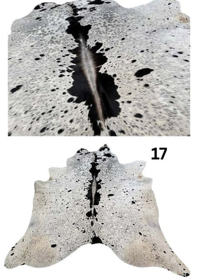 Salt and pepper cowhide rug number 17 with natural markings on a white background