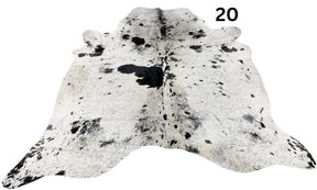 Salt and pepper cowhide rug number 20 with natural markings on a white background