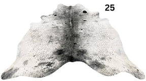 Salt and pepper cowhide rug number 25 with natural markings on a white background