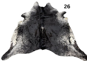 Salt and pepper cowhide rug number 26 with natural markings on a white background