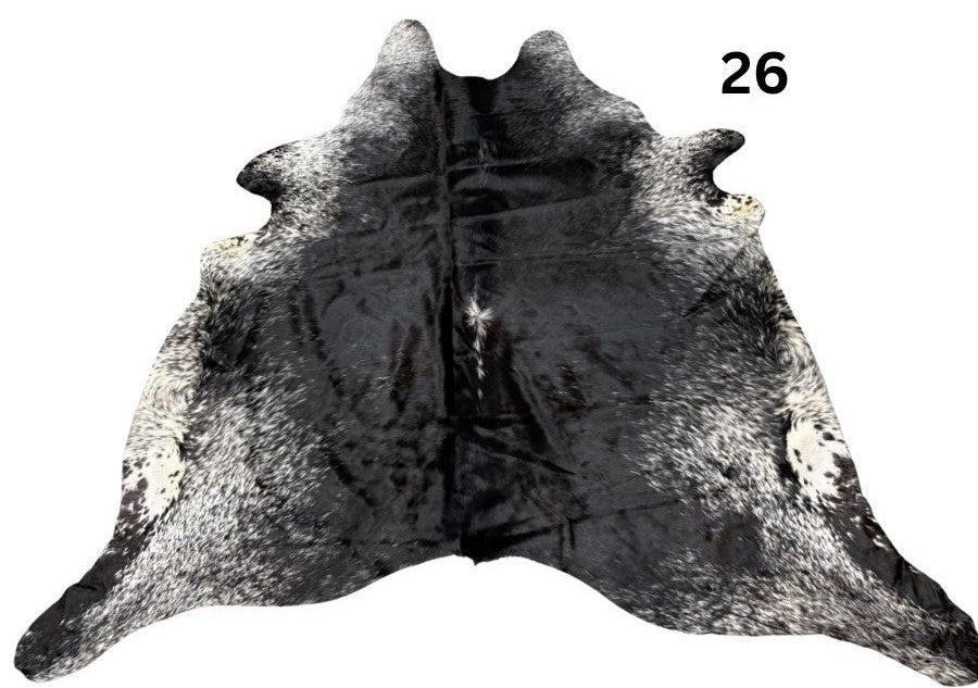 Salt and pepper cowhide rug number 26 with natural markings on a white background