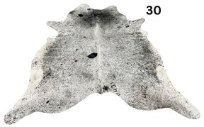 Salt and pepper cowhide rug number 30 with natural markings on a white background