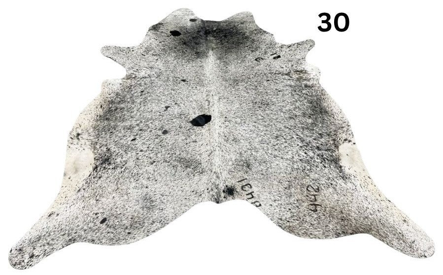 Salt and pepper cowhide rug number 30 with natural markings on a white background