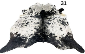 Salt and pepper cowhide rug number 31 with natural markings on a white background