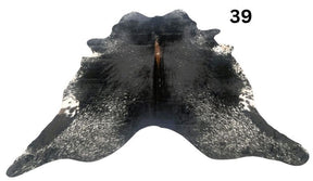 Salt and pepper cowhide rug number 39 with natural markings on a white background