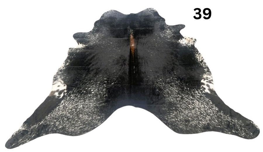 Salt and pepper cowhide rug number 39 with natural markings on a white background