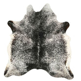 Salt and pepper cowhide rug example showing natural marbling and speckled pattern on a white background