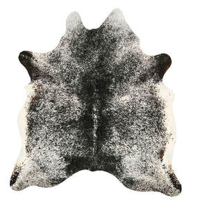 Salt and pepper cowhide rug example showing natural marbling and speckled pattern on a white background