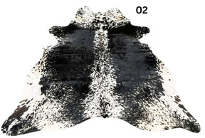 Salt and pepper cowhide rug number 02 with light base tones and fine speckled markings on a white background