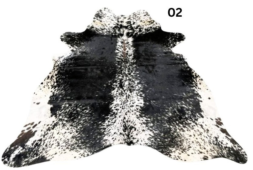 Salt and pepper cowhide rug number 02 with light base tones and fine speckled markings on a white background