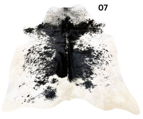 Salt and pepper cowhide rug number 07 with light base tones and fine speckled markings on a white background