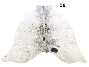 Salt and pepper cowhide rug number 08 with light base tones and fine speckled markings on a white background