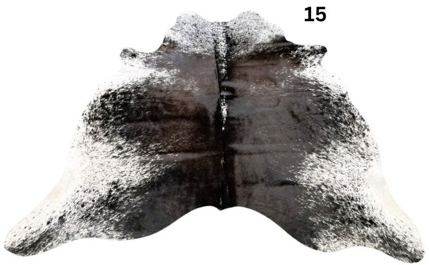 Salt and pepper cowhide rug number 15 with light base tones and fine speckled markings on a white background